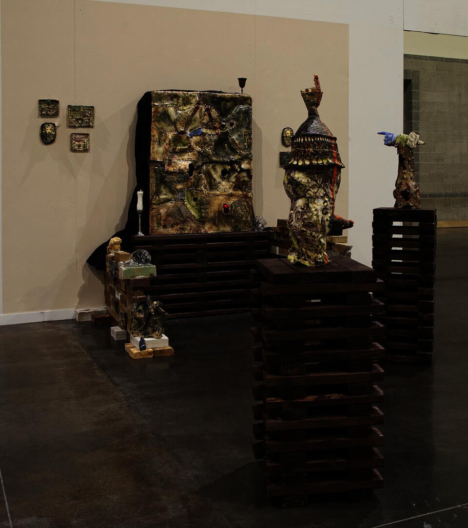 installation of big porcelain box with multiple ceramic objects to the sides