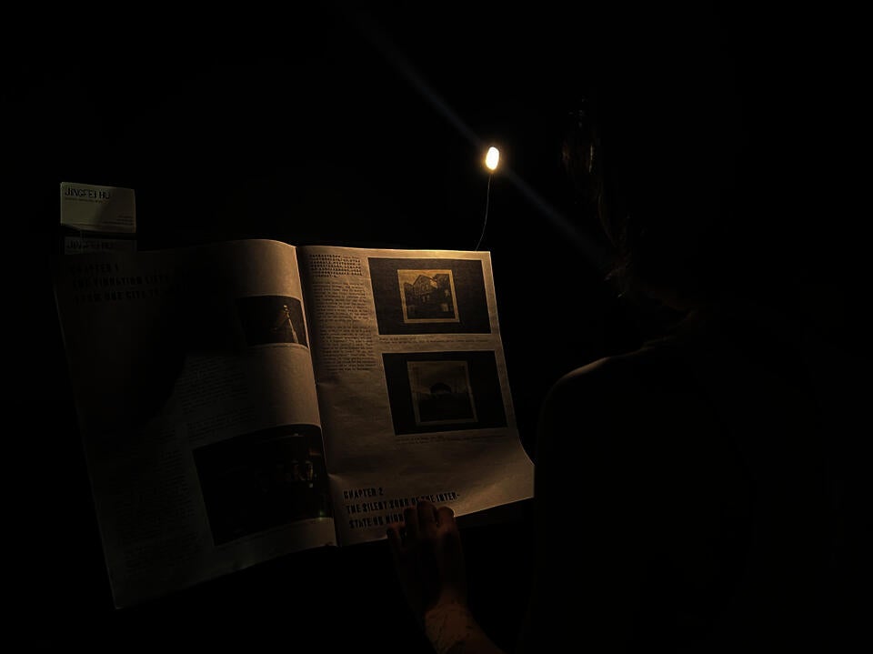 Audience reading the book