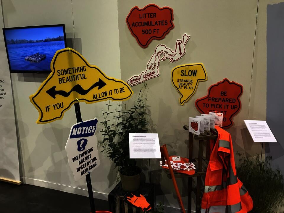 Installation view of Neighborhood Trash Signs