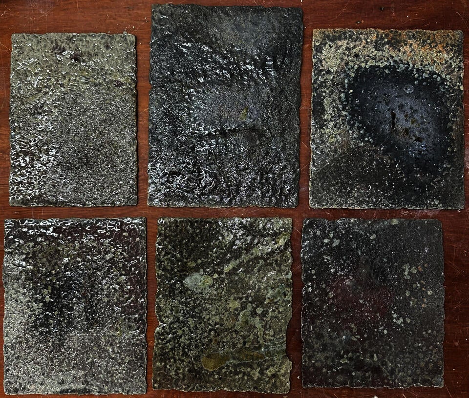 Curse tablets surfaced with lead, copper and tin glazes, reduction fired to cone 10 in a sagger filled with saw dust, wood ash, charcoal, and wood