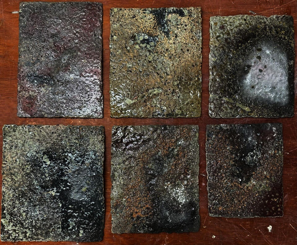 Curse tablets surfaced with lead, copper and tin glazes, reduction fired to cone 10 in a sagger filled with saw dust, wood ash, charcoal, and wood