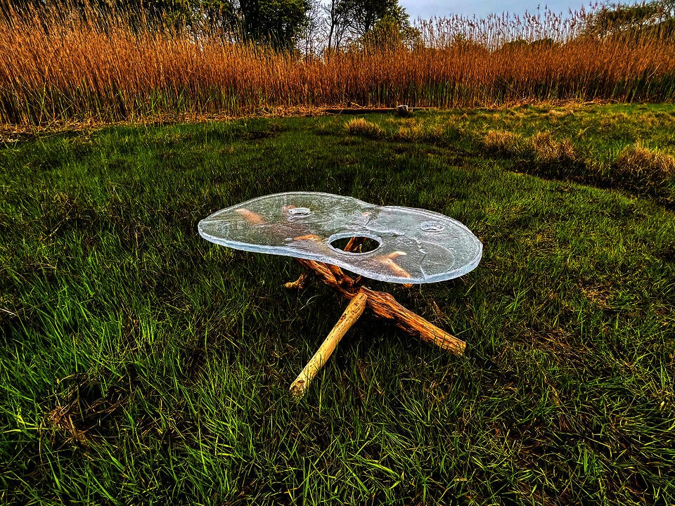 Ritual table positioned at the transition zone of the marsh on the RISD farm. It is made from hotcasted glass and driftwood.