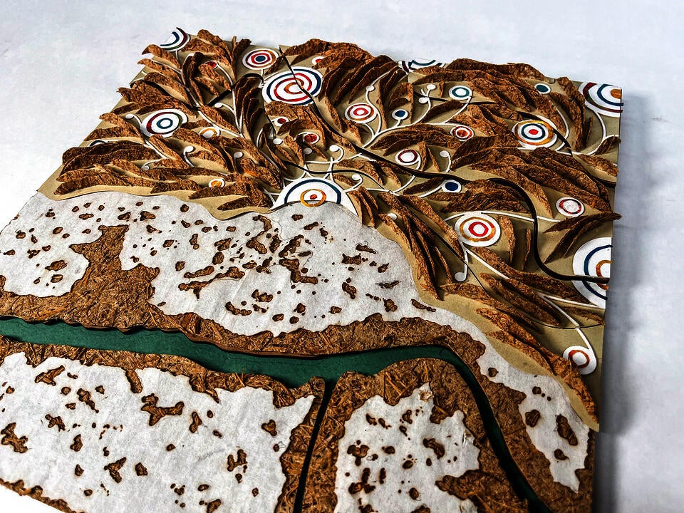 Hand crafted landscape model, made of Phragmite paper, hand collage, chipboard and burned mulberry paper