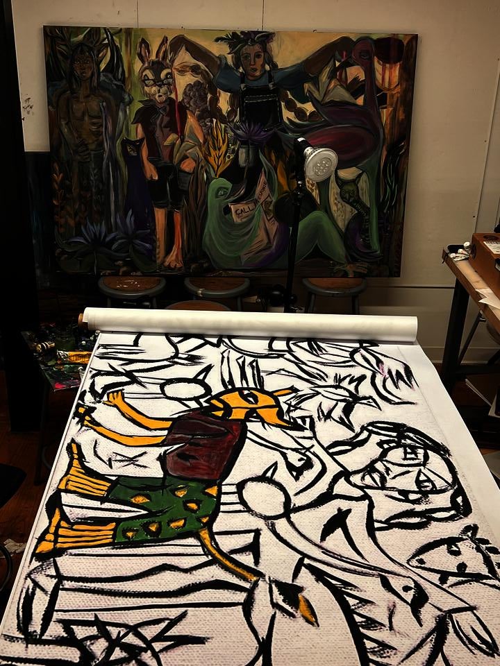 Two paintings in a studio space