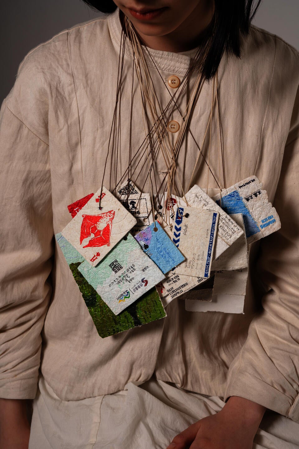 Numbers of ticket pendants worn on the body. 