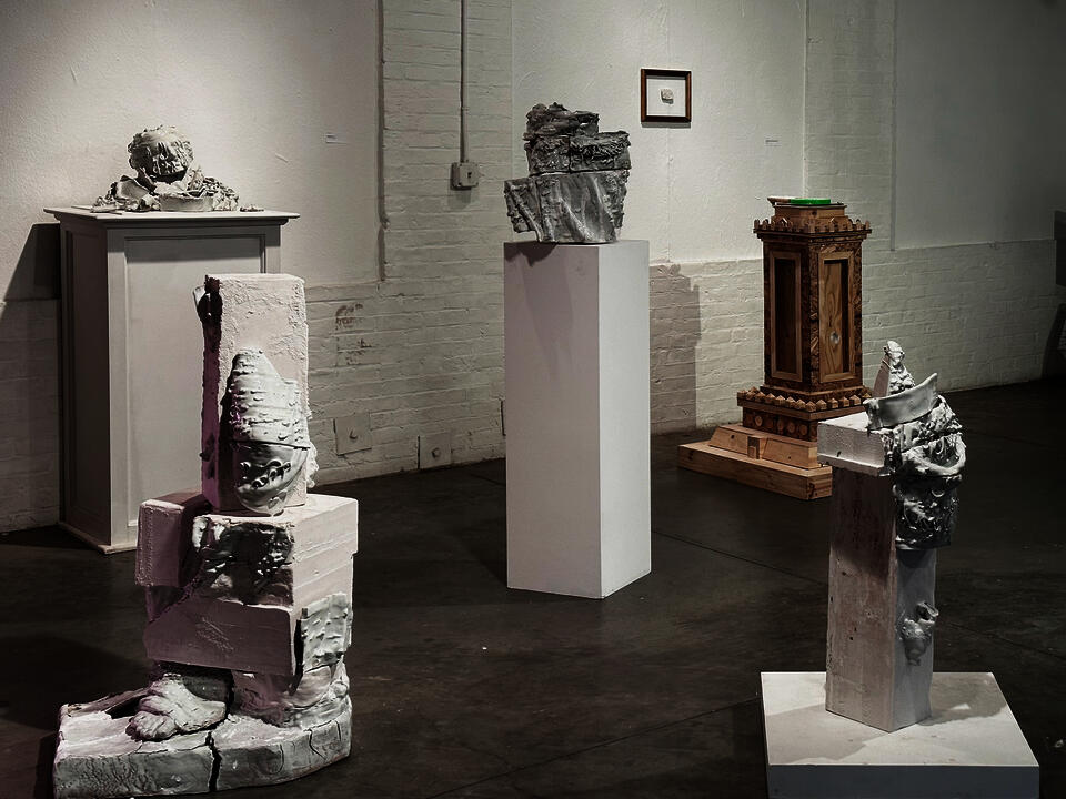 Glitched 3D printed ceramic replica of Venus de Milo, fragmented and cast into blocks of plaster in pieces.