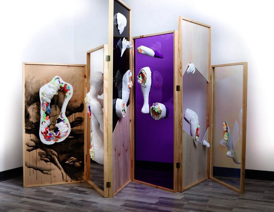 Folding screen structure with varying heights, and a figure spliced through each frame. Dissection of the figure showing internal structure made of colorful clay and foam.