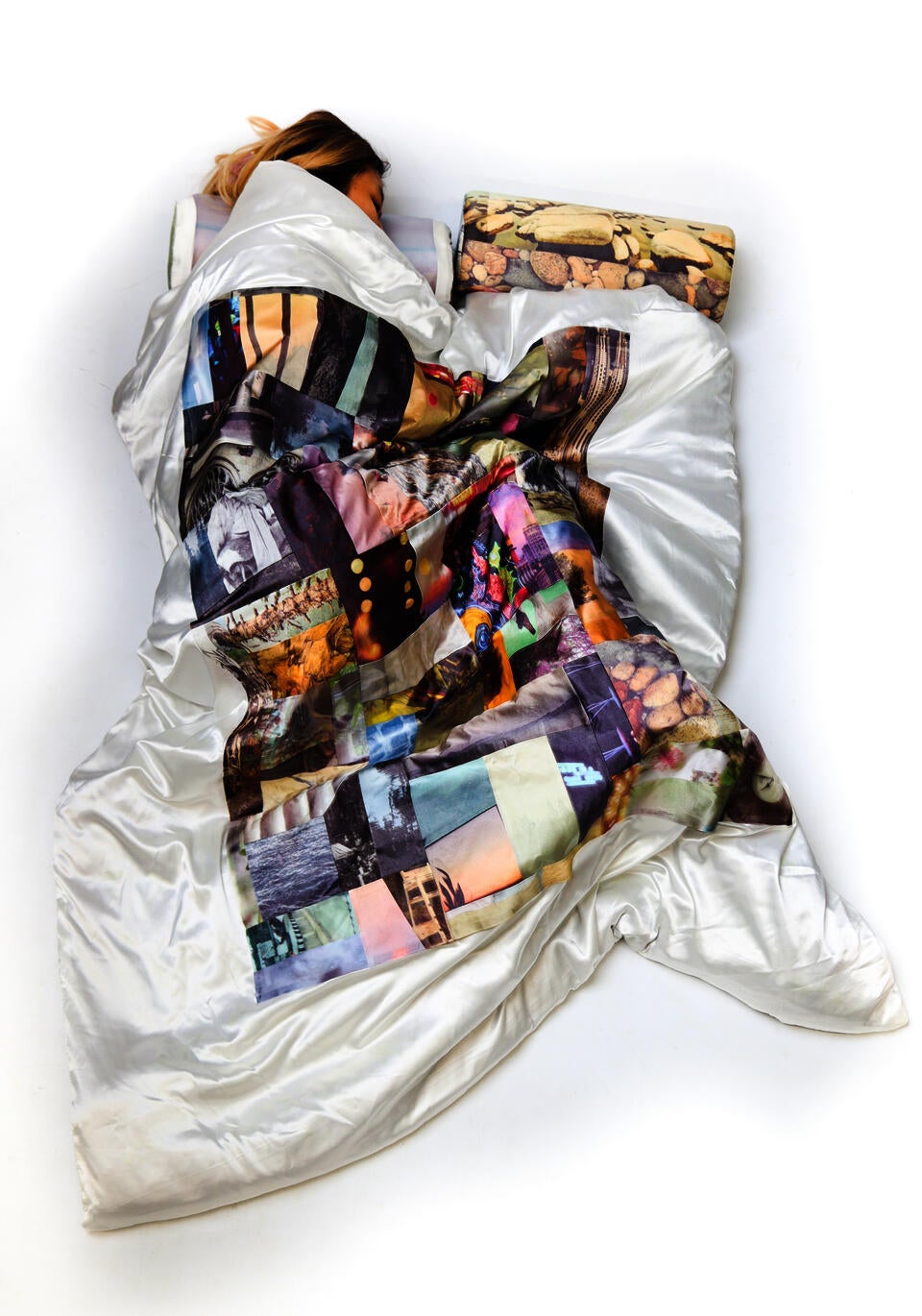 Indescernible images printed on silk, quilted in piece-meal to create a large silk blanket.