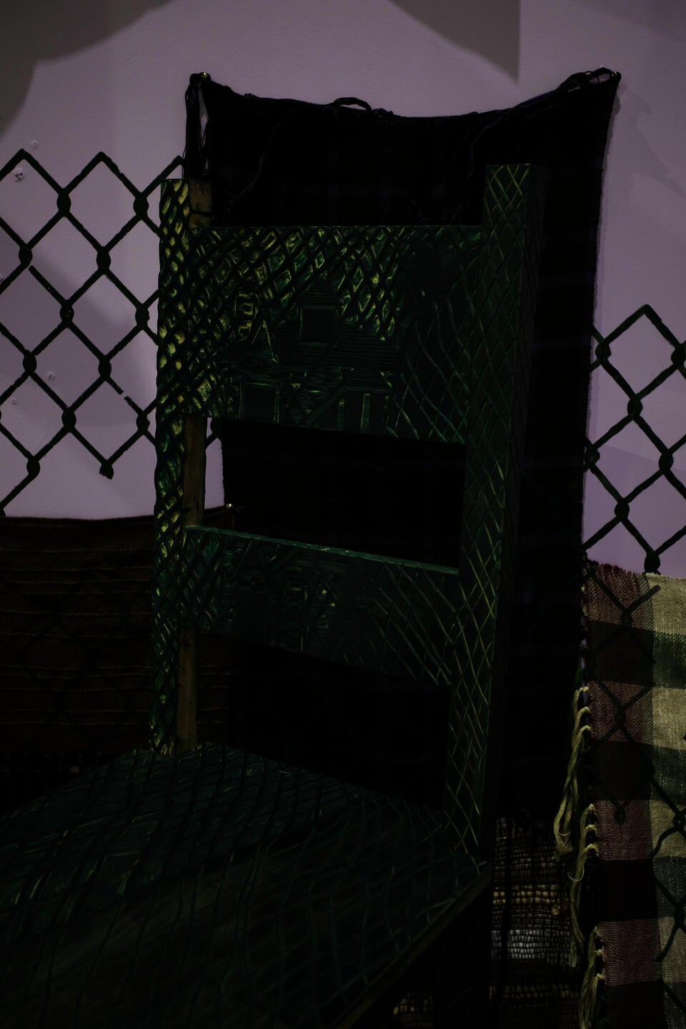 image of house carved into a chair stained with green ink