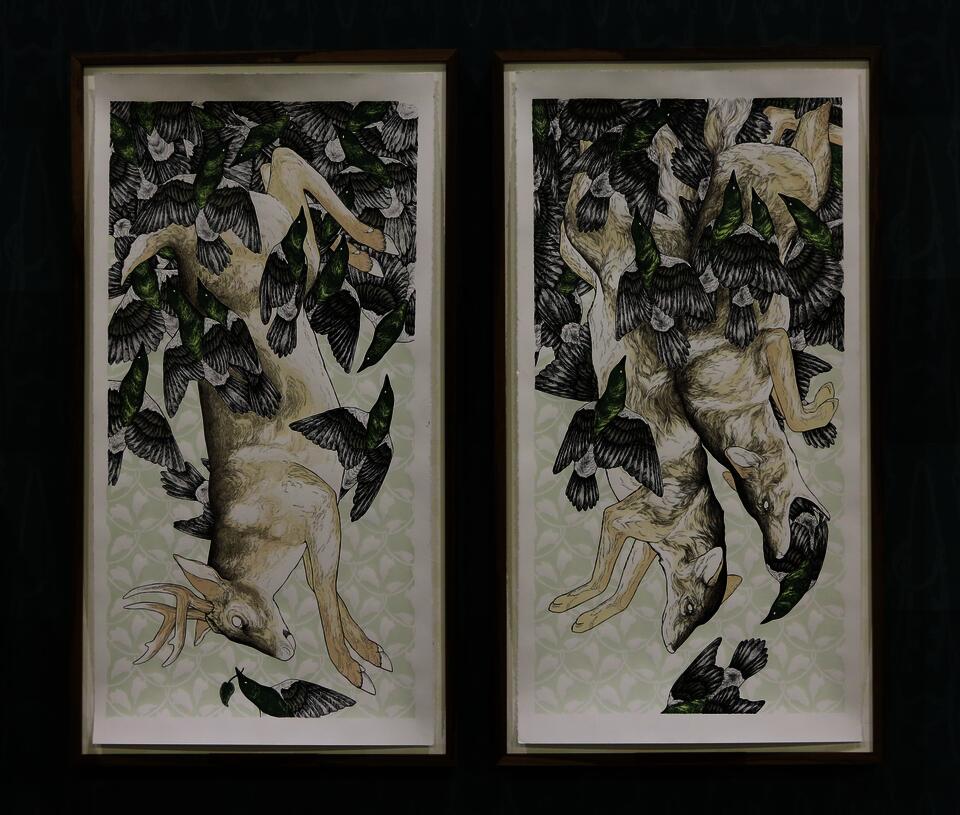 Screen prints of coyote and deer surrounded by flying grackles