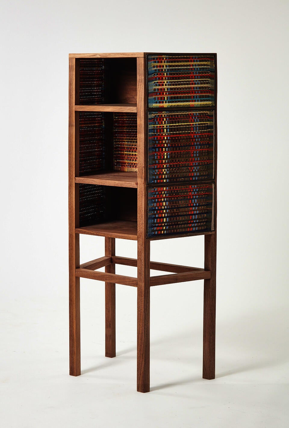 This is a coffee table consisting of three legs and a tabletop. Both the tabletop and the legs are joined together with a slight curvature.