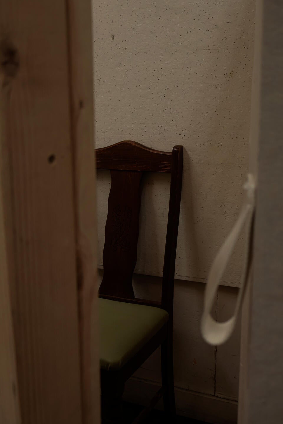 Closely cropped image through a slightly open door into the seat in the booth