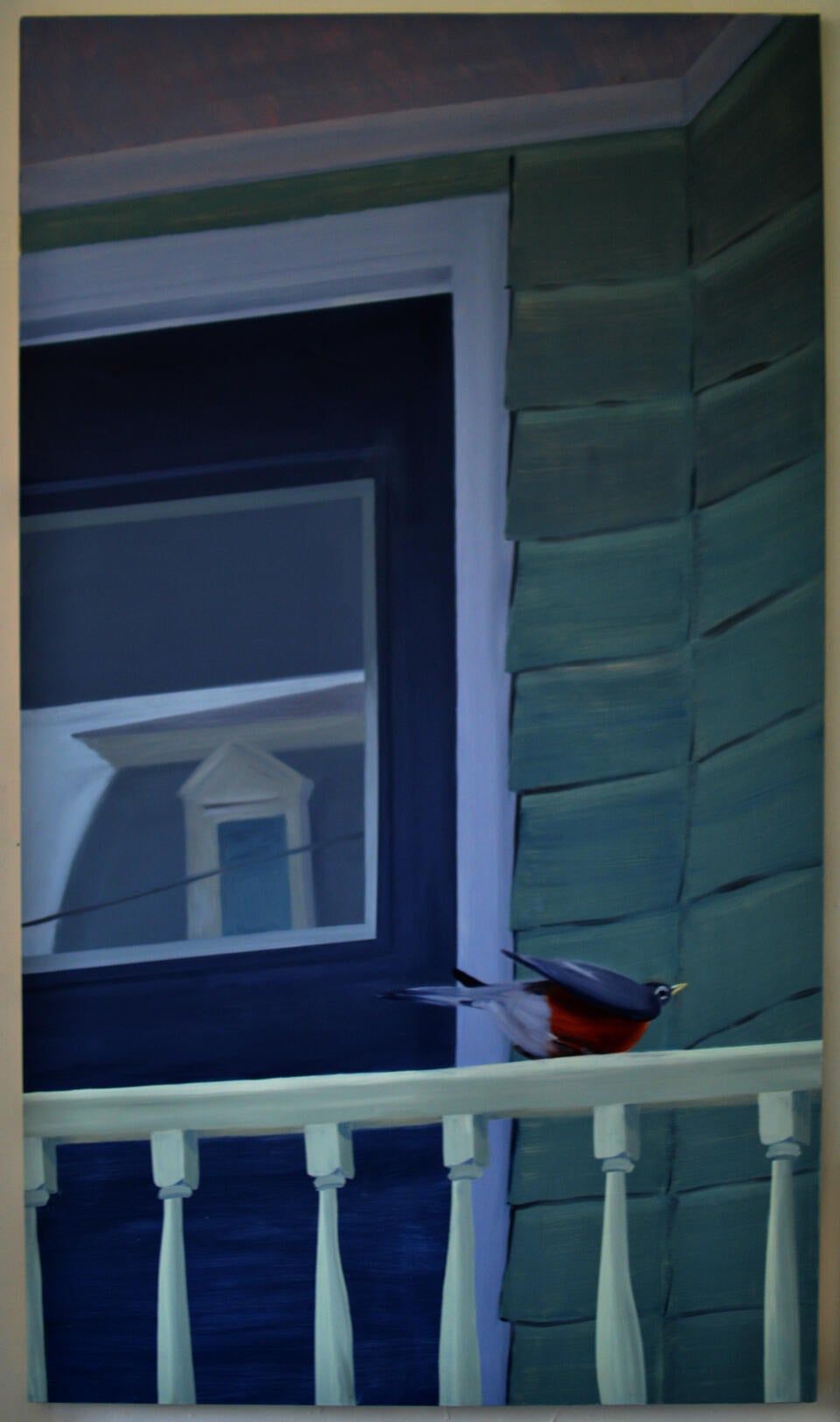 A bird begins to take flight from a railing in front of a residential front door.