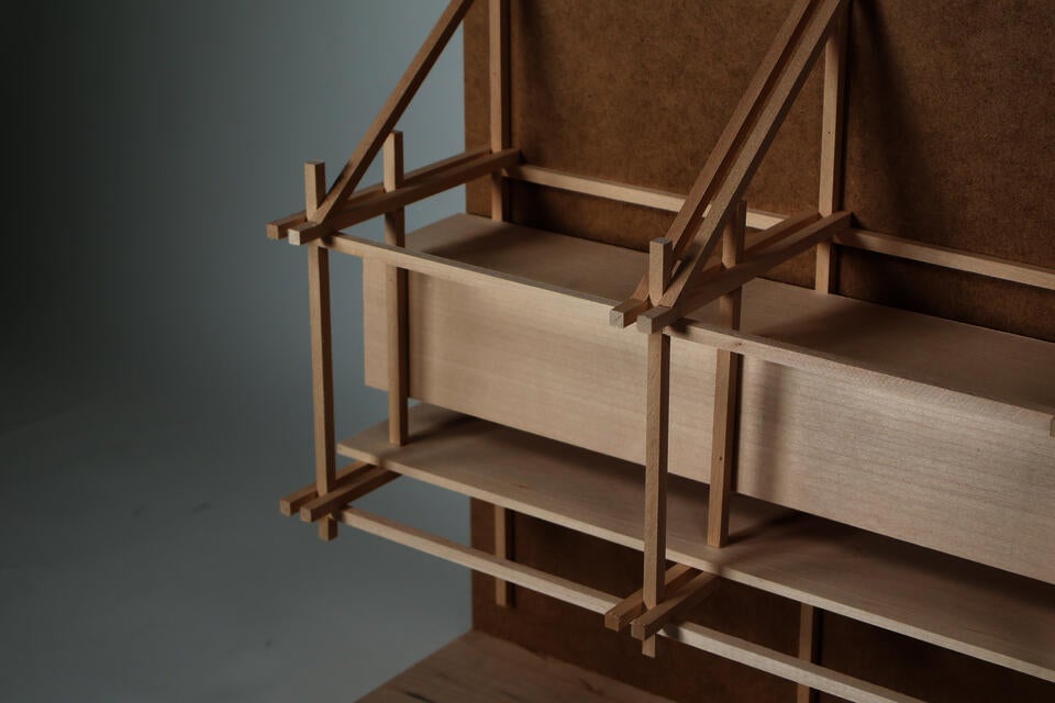 A tectonic model exploring "parasitic" hanging structures on the facades of existing buildings.