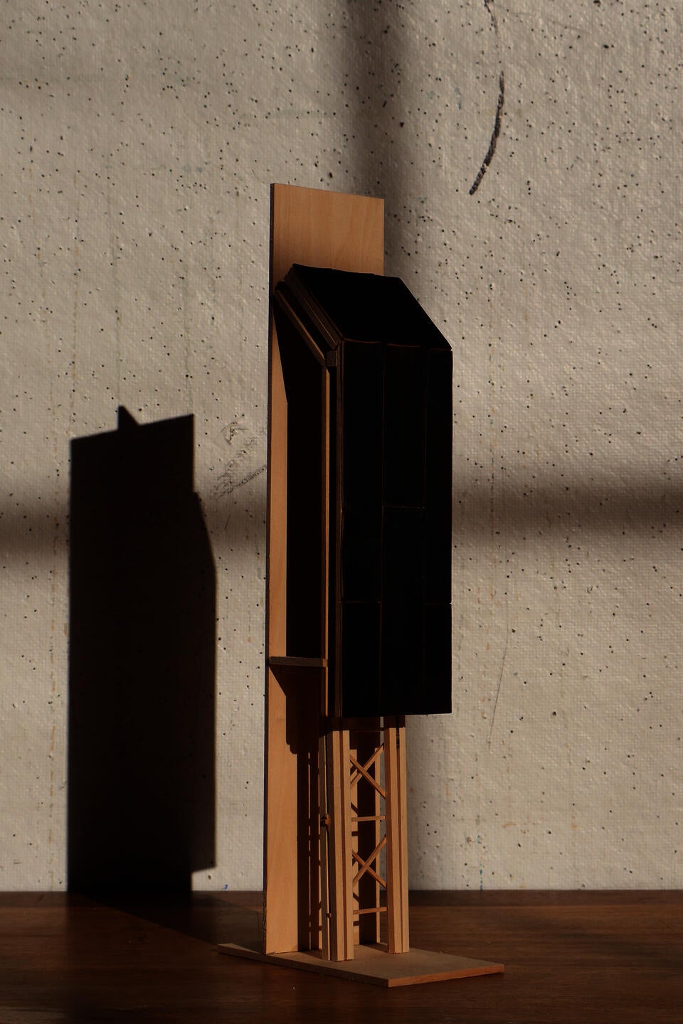 An early material study explores charred wood on as a facade treatment