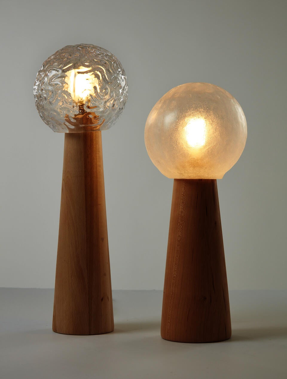 Table Lamps made of glassblown glass, beech, cherry and lightbulb.