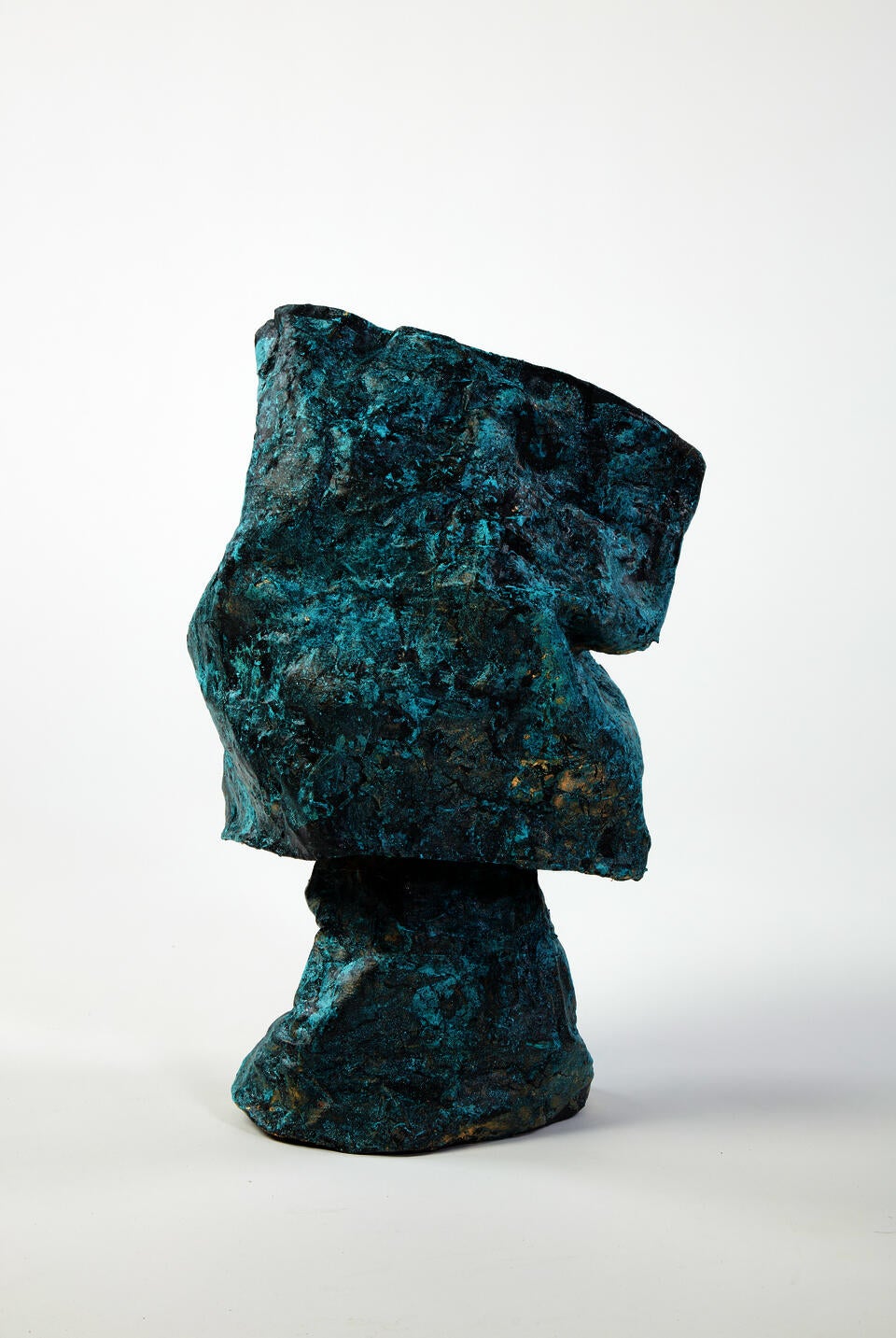 This fragile looking lamp is is covered in a metal looking range of black, oxidezed copper and gold.