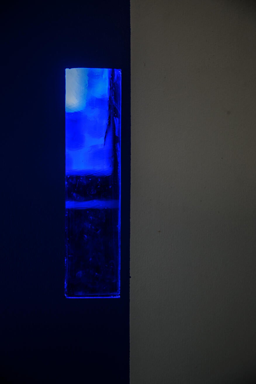 Blue stained glass integrated into fabricated wall acts as a filter to my memory realm, unraveling blue carpet memories.
