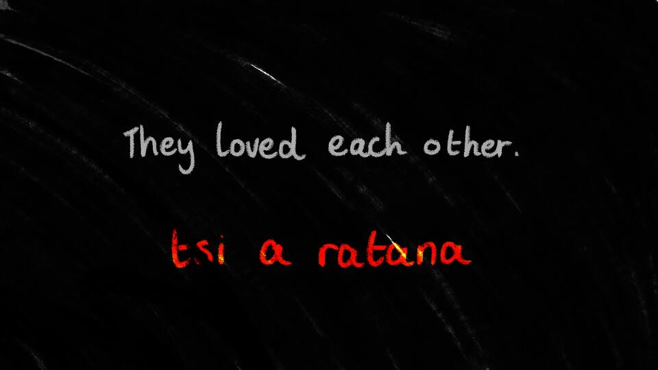 "Black fuzzy background with white English text that reads:  ""They loved each other"". Line below in red text in Sasi: ""tsi a ratana"""