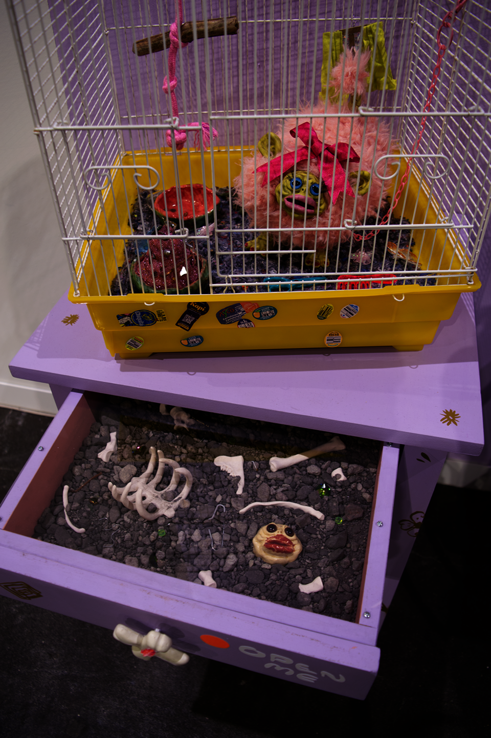 Detail shot of a beautiful ugly creature inside of a cage.