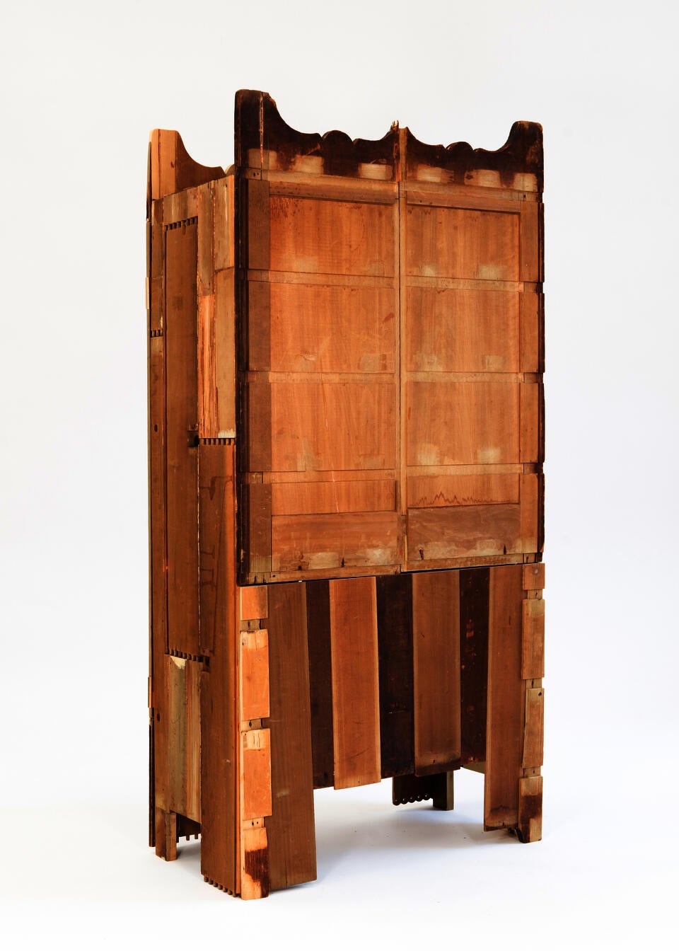 A Cabinet made from the deconstructed materials of a found dresser in warm yellow.