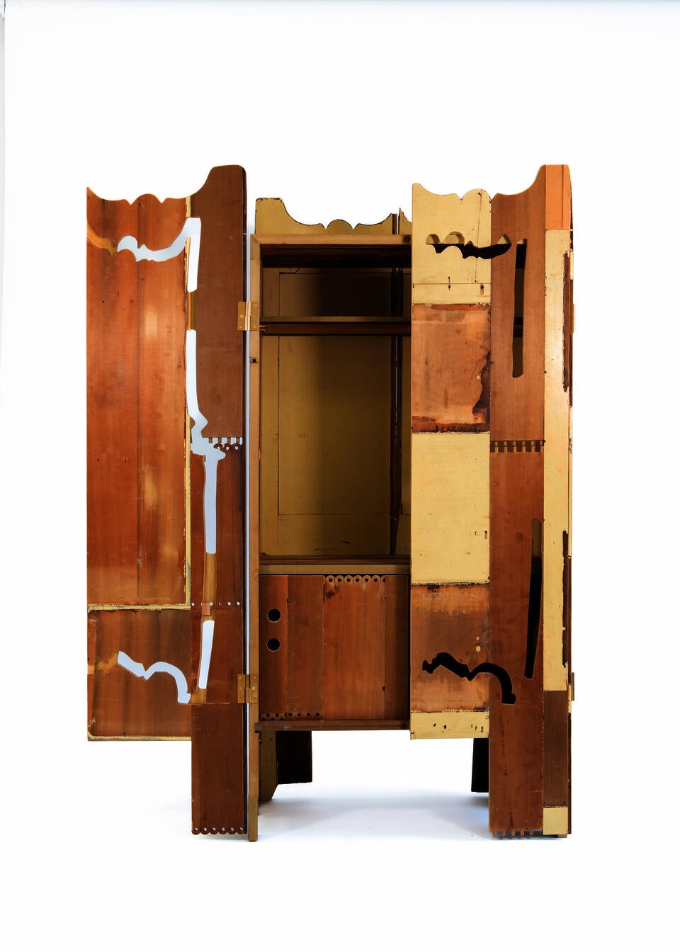 A Cabinet made from the deconstructed materials of a found dresser in warm yellow. 