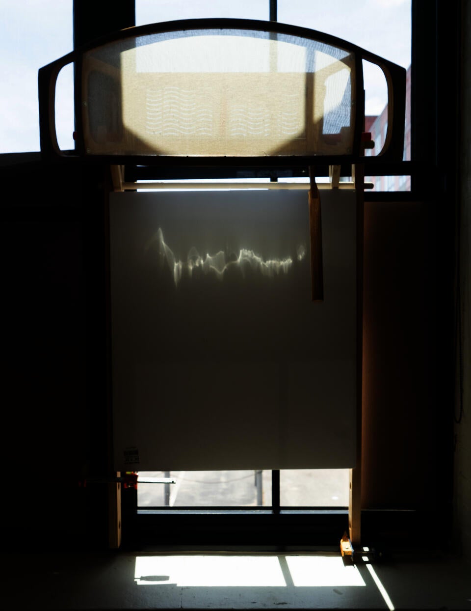 Natural light being reflected to the a canvas through the reflective polymer