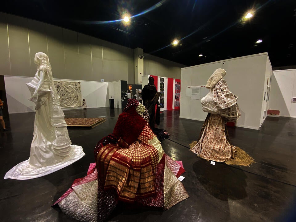 Placed in space, viewers are encouraged to walk around and interact individually with each garment. 