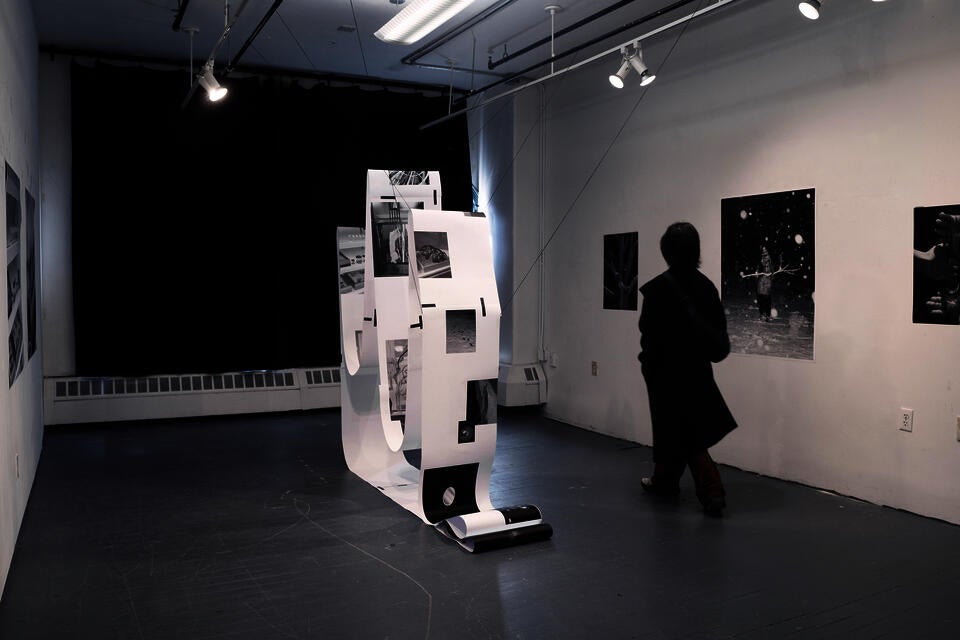 Installation exploring knowledge systems through questioning, with images as forms of knowing within space.