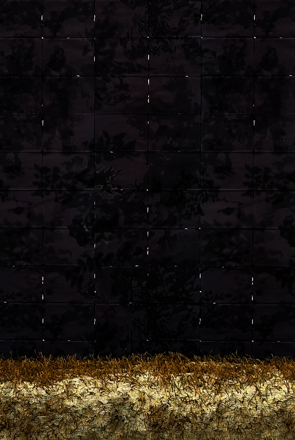 Natural tone and textured woven textiles on concrete surfaces, surrounded by grid patterned wallpaper and light. 
