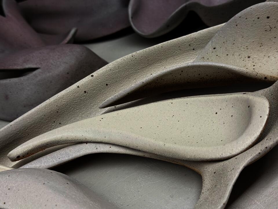 Detailed view of a ceramic sculpture with textured surface