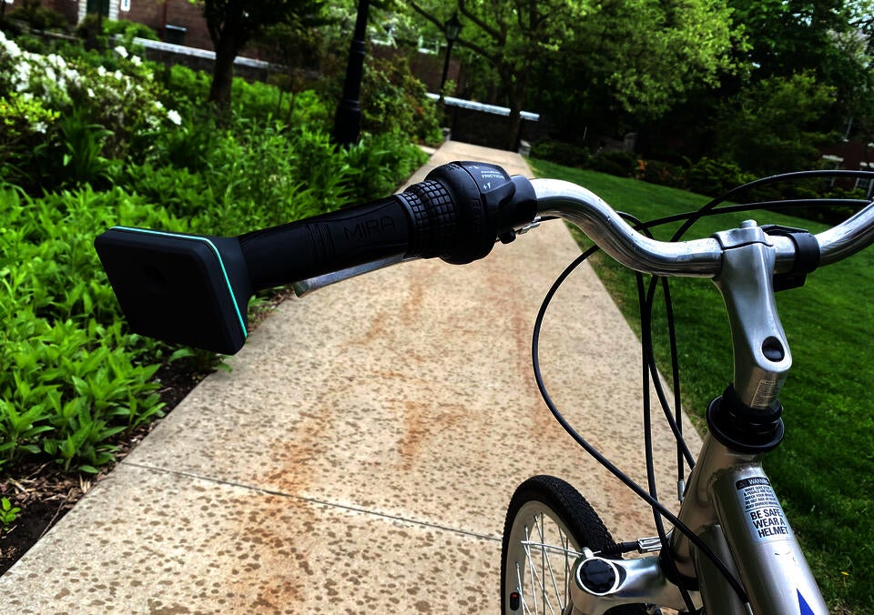 MIRA, a machine vision haptic handlebar grip mounted on a bicycle.