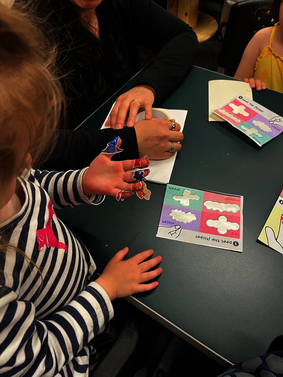 Children playing with the Sip Jab Zoop stickers. Designed to reduce the fear of needles and turn into a fun experience.