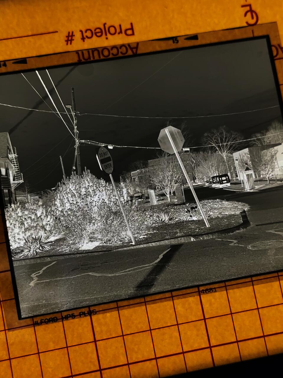 The negative of my print, taken in the middle of Hope St, showing my process: shooting, walking, developing, printing.