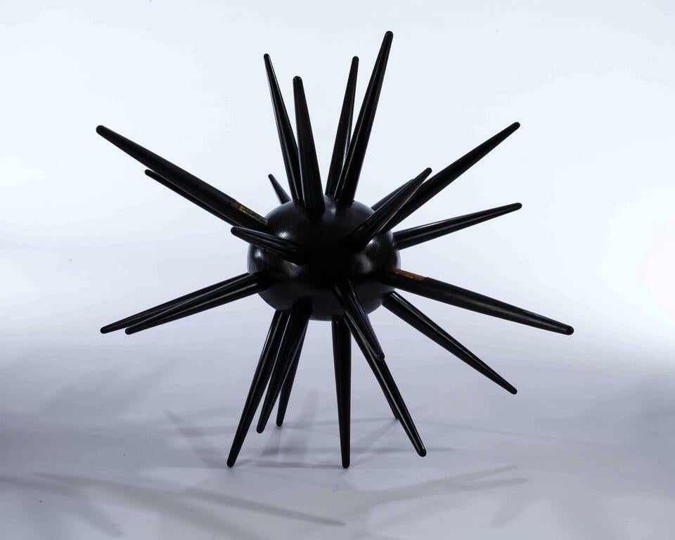 Urchin is a spiked ash wood cabinet with hidden drawers, symbolizing self-protection and inner vulnerability.
