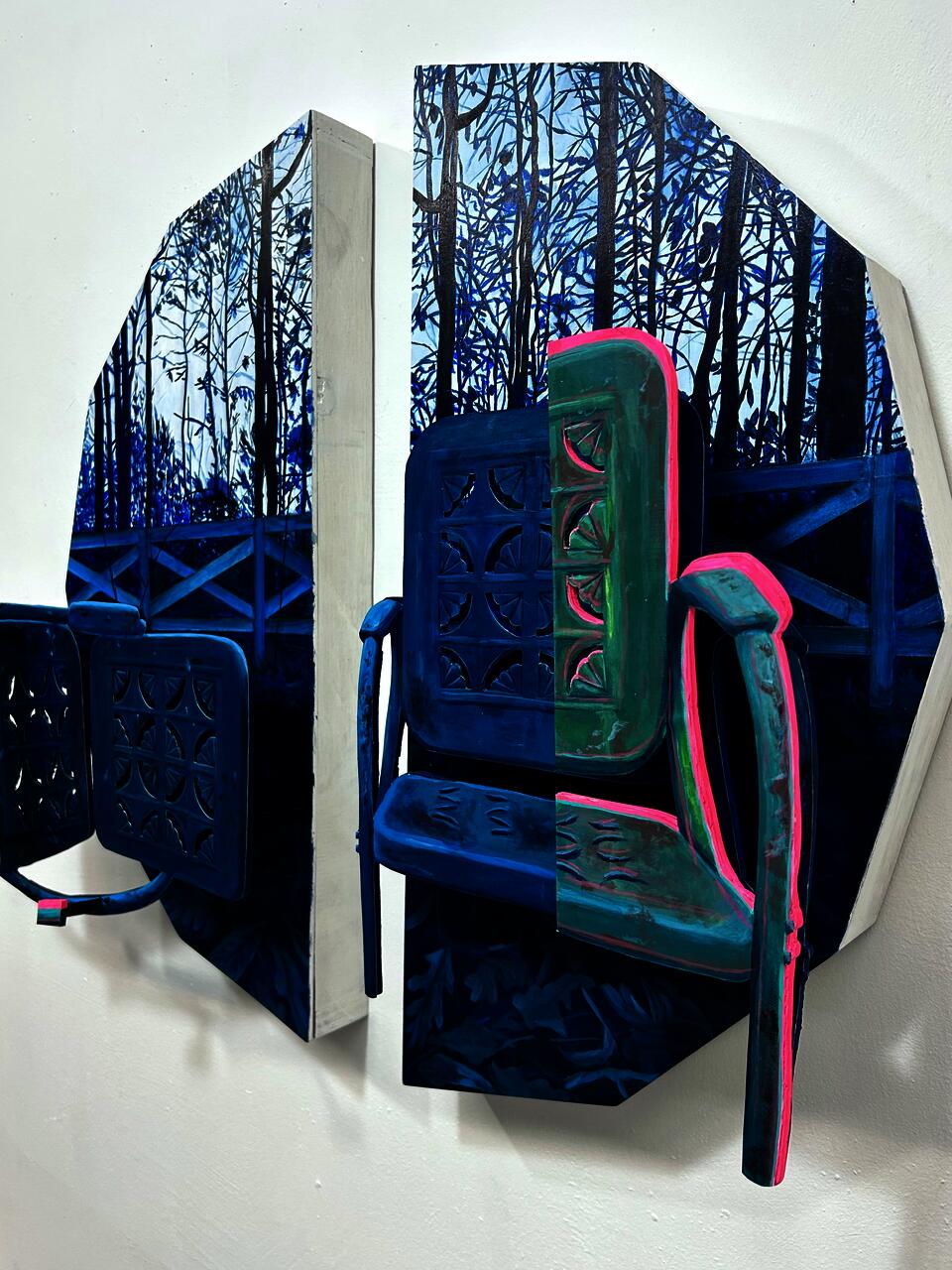 Side angle of two blue chairs. 
