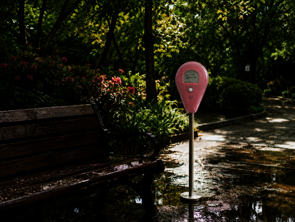 AI-generated rendering of the Spark installation placed beside a bench in a park setting.