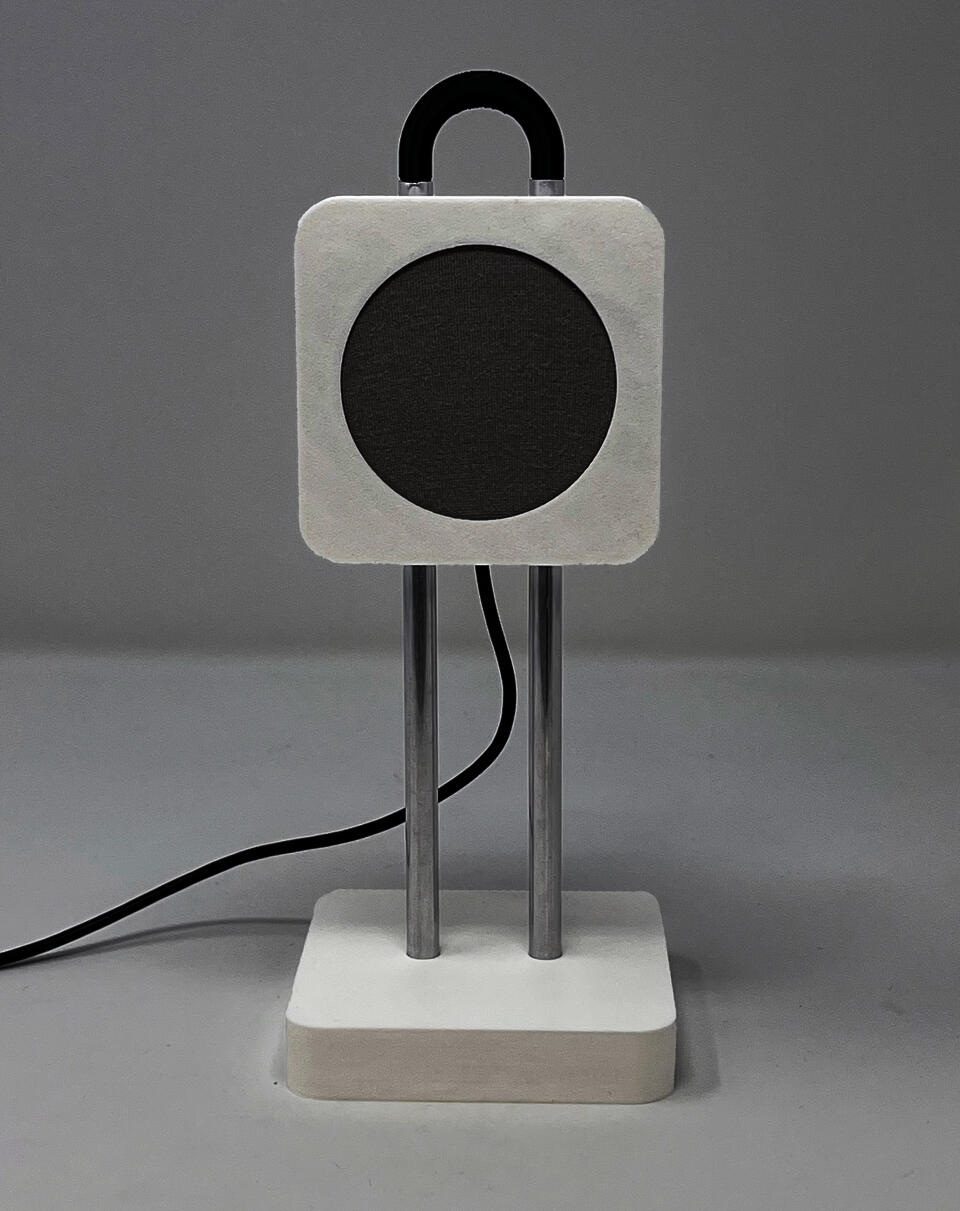The Concord passive health tracker: a small white nightstand device with a circular gray radar sensor on a rounded square head, mounted on two chrome posts atop a square base, with a black handle on top.
