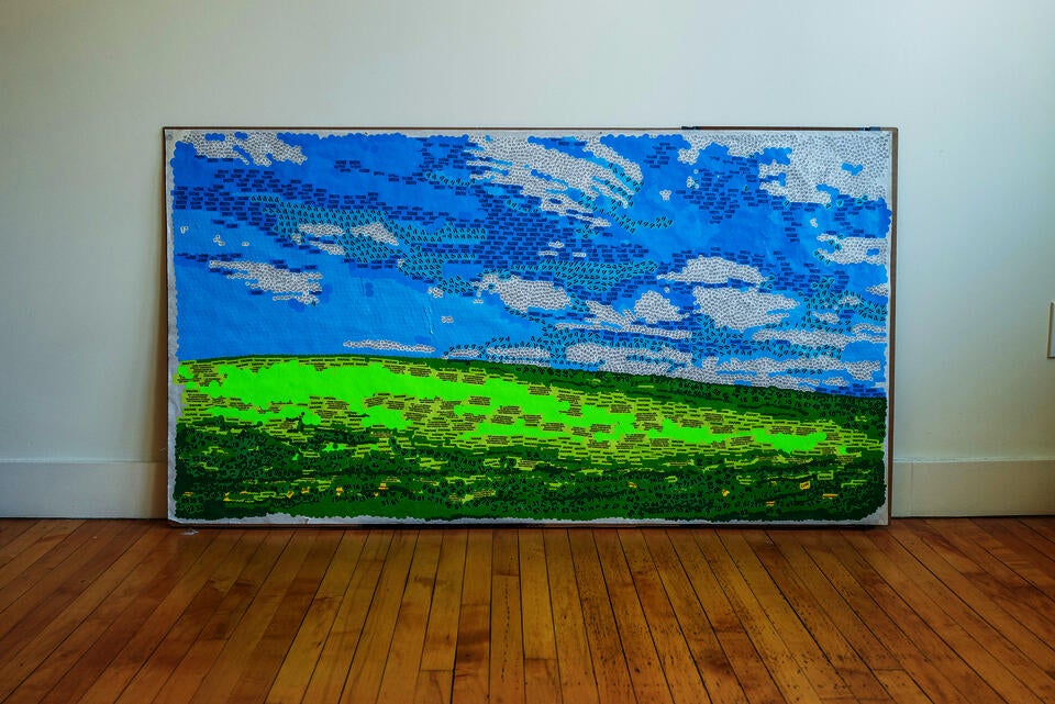 A mosaic landscape assembled from thousands of repurposed stickers — hazard warnings, food labels, confidentiality markers — evoking pointillism. From afar, nature; up close, the symbols of automated consumption.
