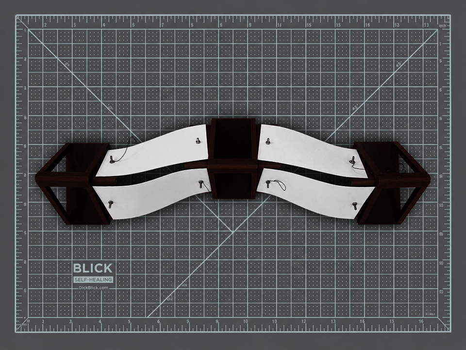 An assembly of three triangular cylindrical components with embedded Nitinol wire, forming the segmented body of Vermis to enable sequential contraction and directional crawling movement.