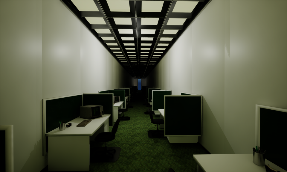 A long, narrow office with rows of green cubicles, desks and chairs, old computers, and bright ceiling lights leading toward a distant doorway.